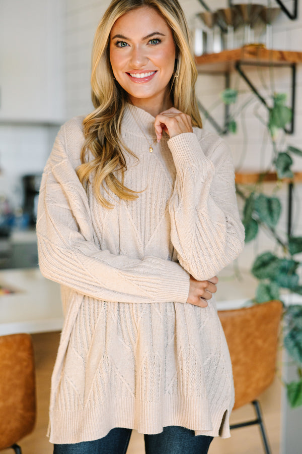 Light-colored turtleneck women's sweater