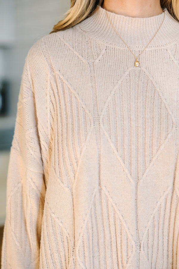 Light-colored turtleneck women's sweater