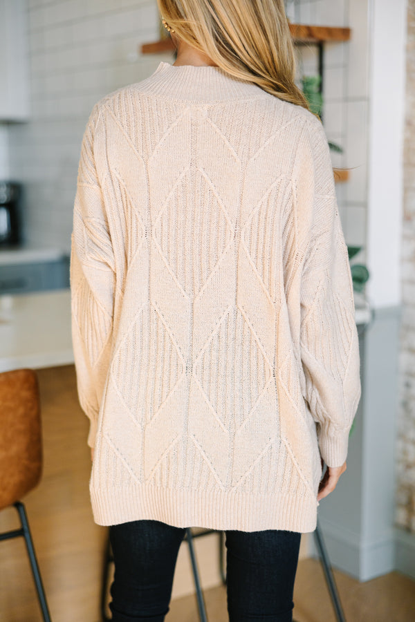 Light-colored turtleneck women's sweater