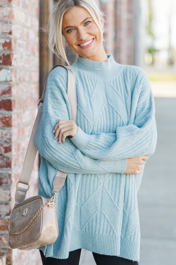Light-colored turtleneck women's sweater