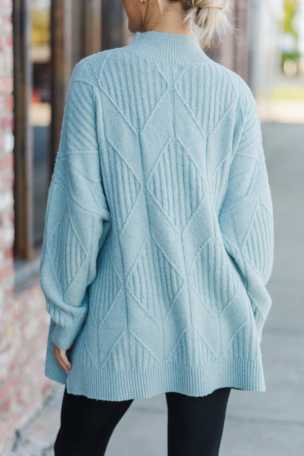 Light-colored turtleneck women's sweater