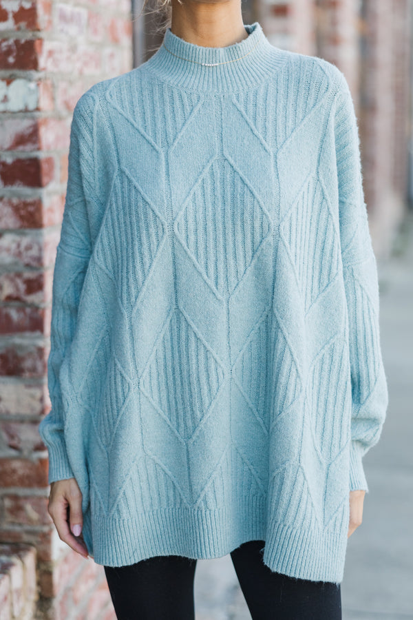 Light-colored turtleneck women's sweater