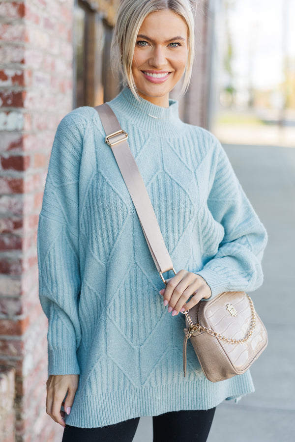 Light-colored turtleneck women's sweater