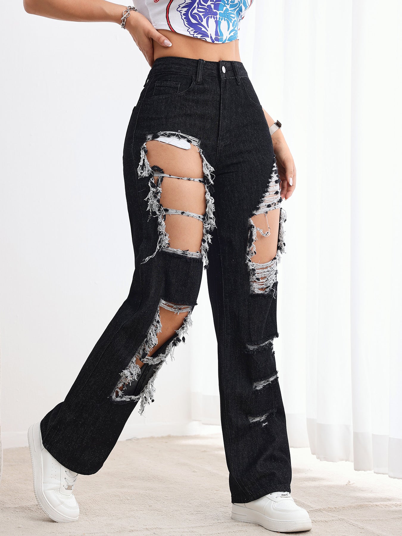 Jeans neri strappati