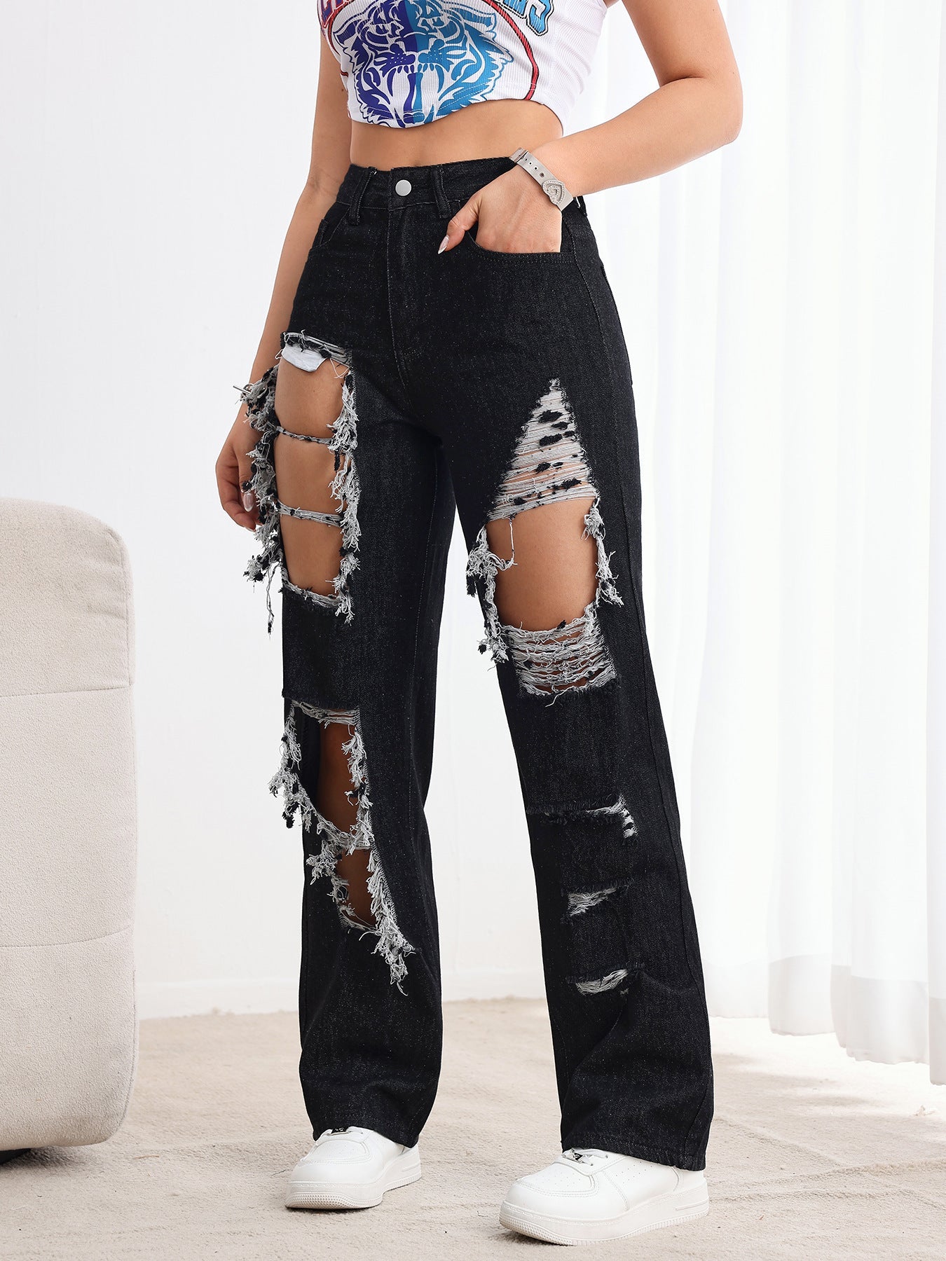 Jeans neri strappati