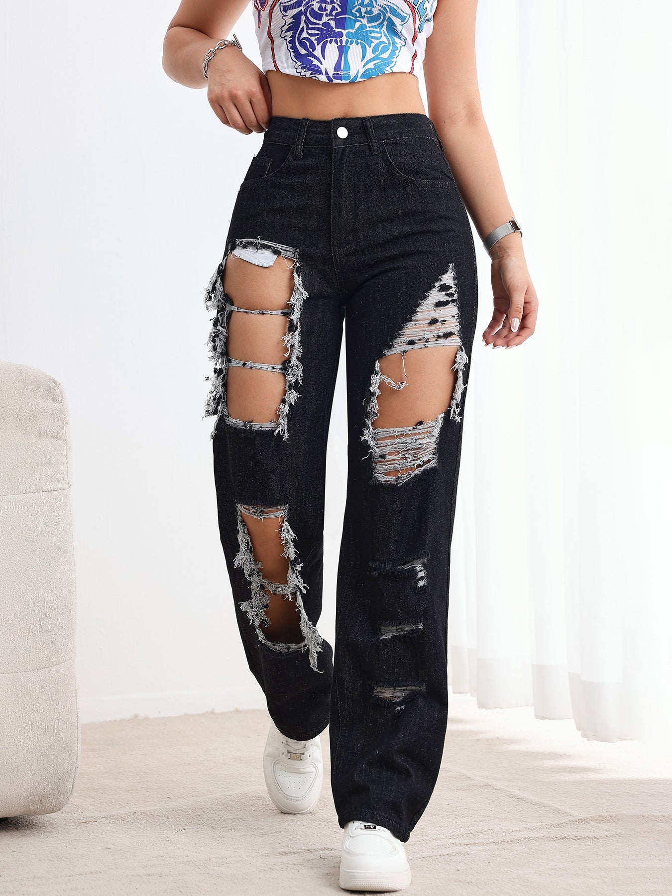 Jeans neri strappati