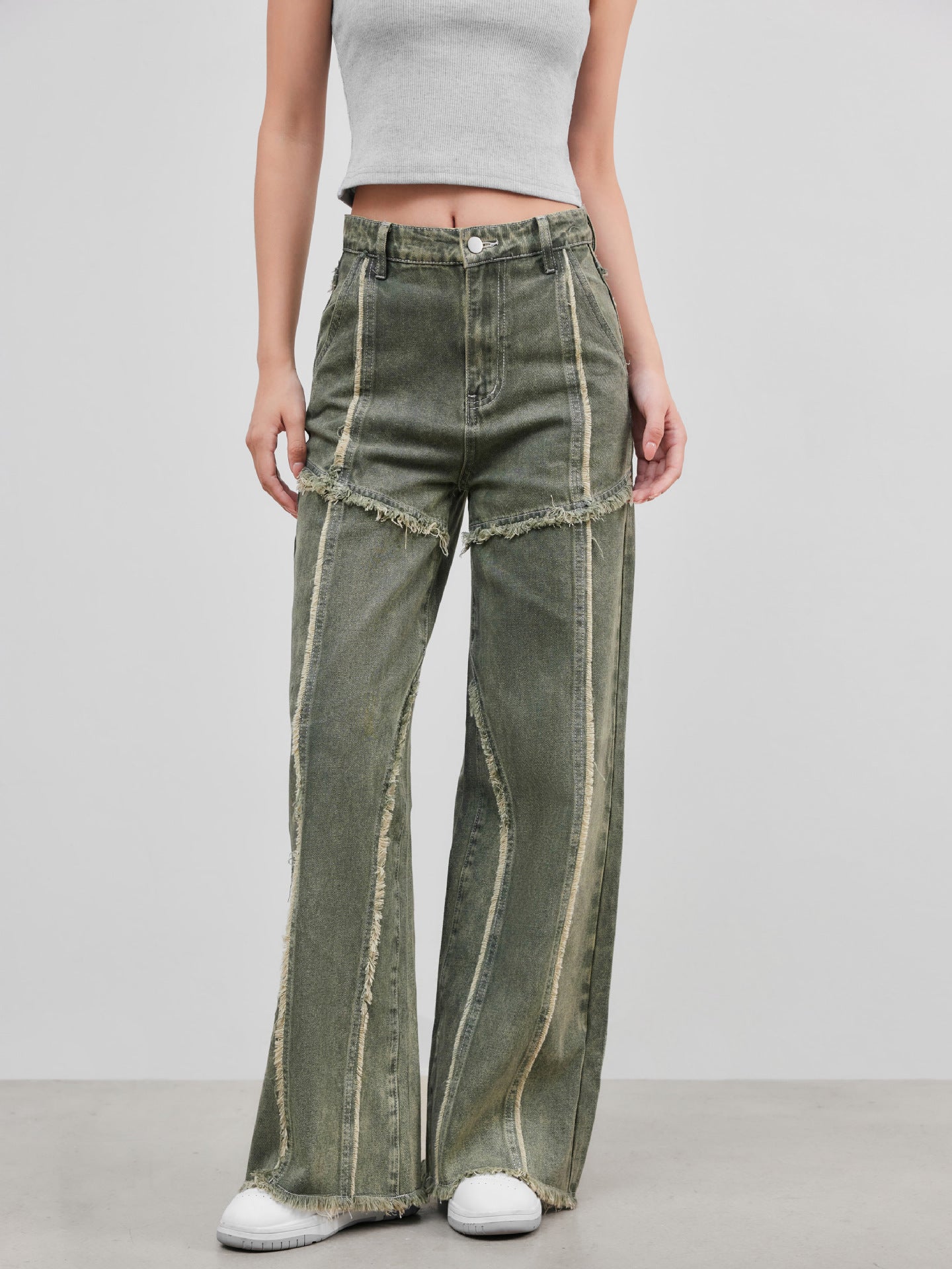Jeans con pannelli a bordo grezzo