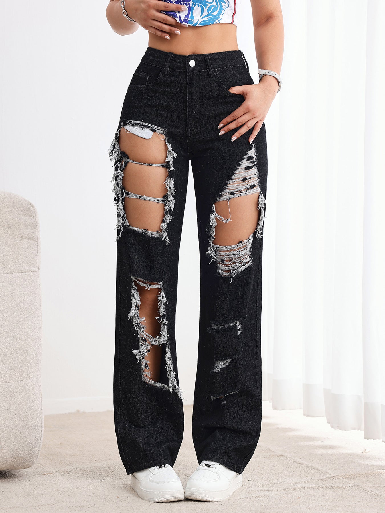 Jeans neri strappati