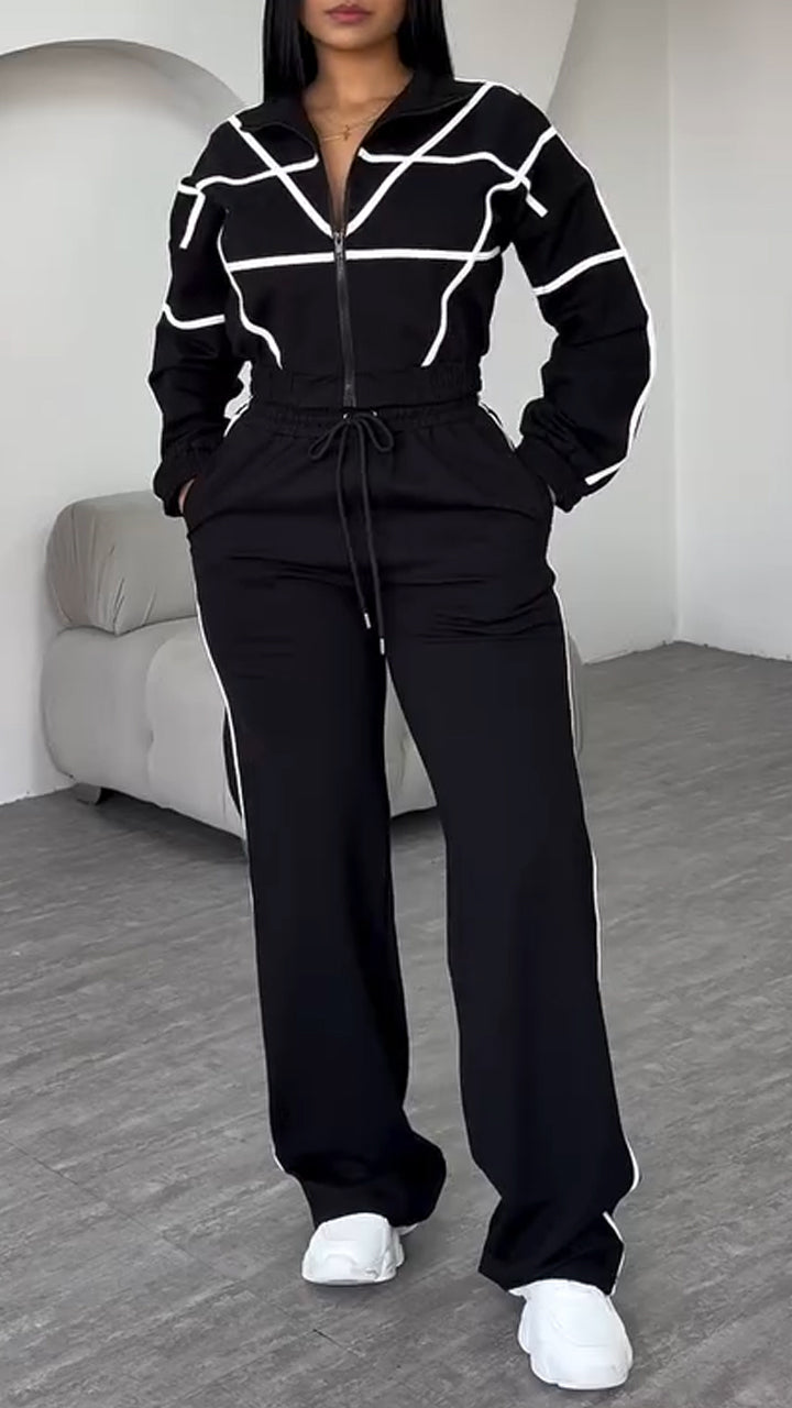 Completo casual da donna con colletto, cerniera e pantaloni a righe
