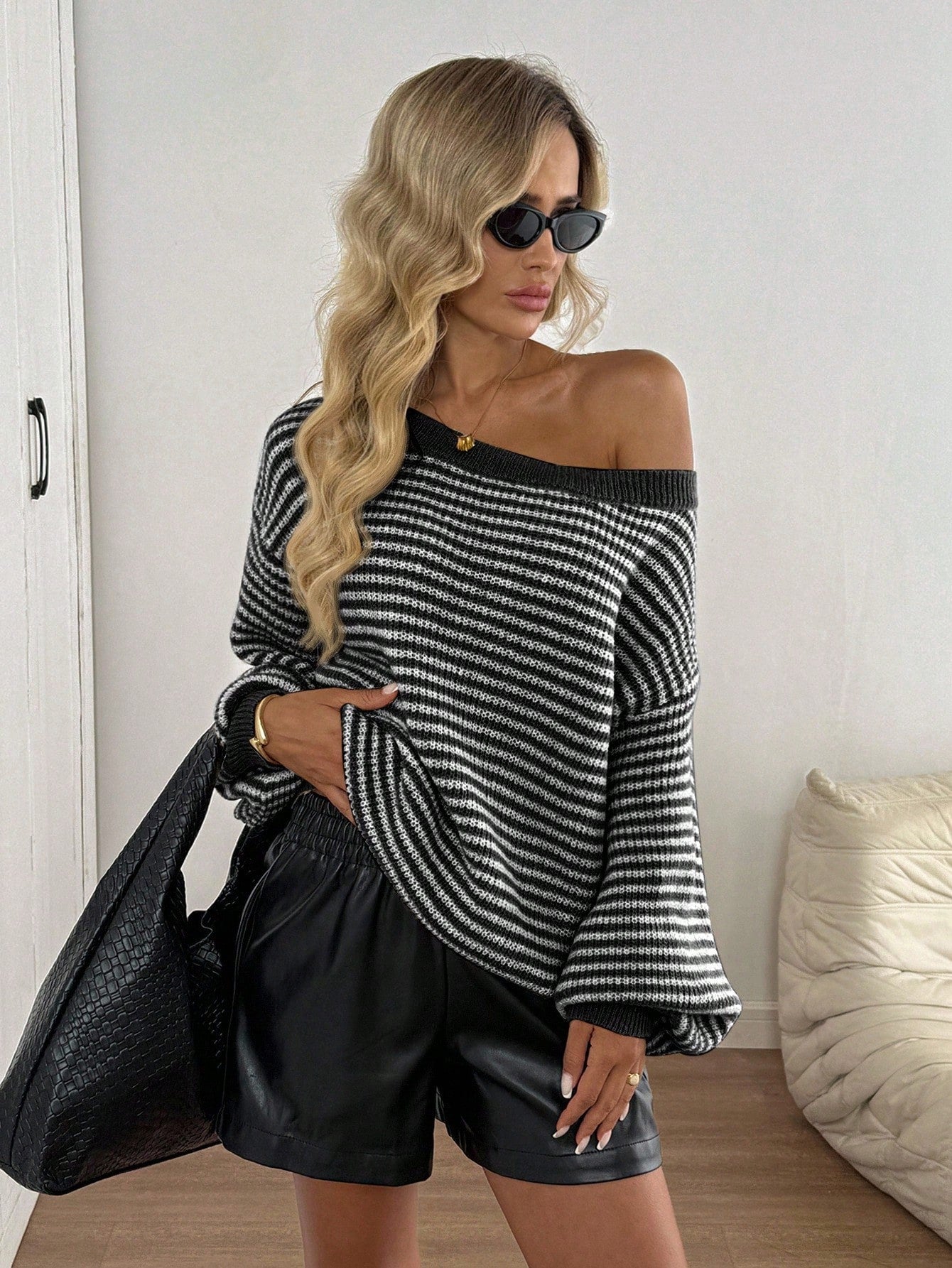 Loose striped off-shoulder knit sweater