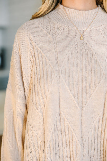 Light-colored turtleneck women's sweater