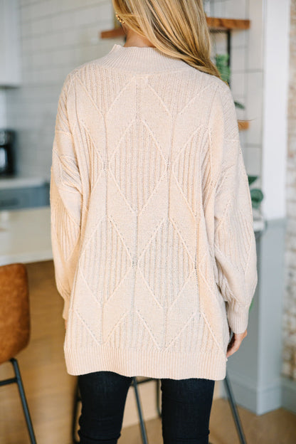 Light-colored turtleneck women's sweater