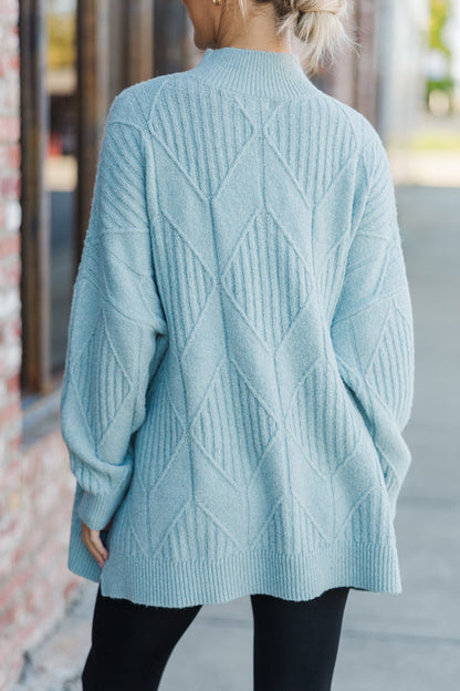 Light-colored turtleneck women's sweater