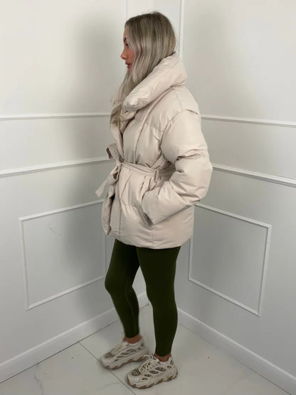 Short quilted jacket with belt